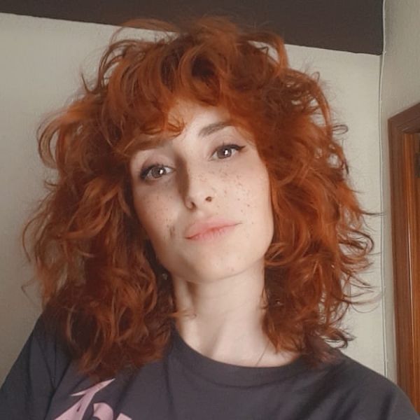 Big Curly Shag Haircut for Women with Ginger Red Hair