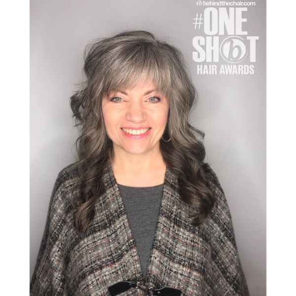 Curly Silver Fox Long Shag Haircuts for Women - a woman with a flanel