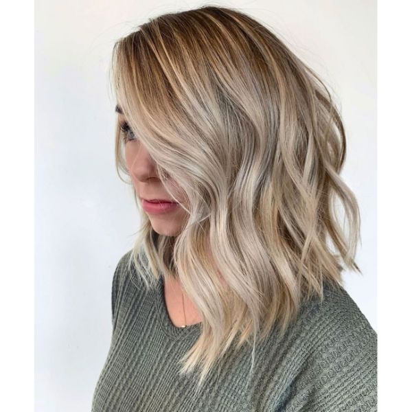 Long Wavy Bob Haircut with Side Swept Bangs and Side Part
