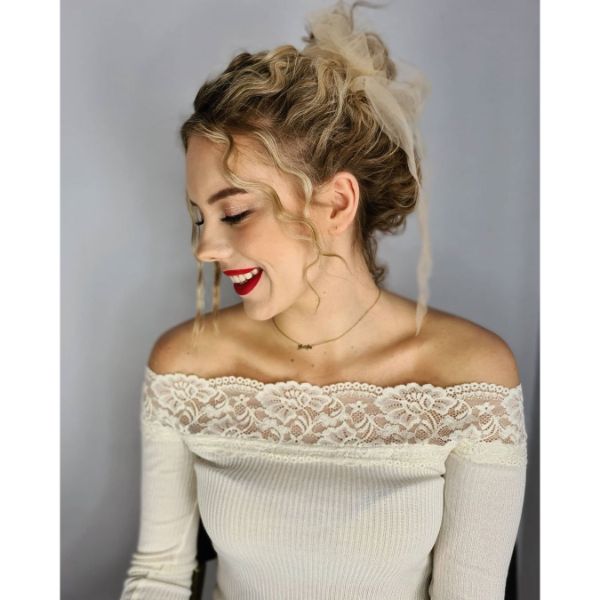 Chic Negligent Updo with High Bun and Wavy Strands 