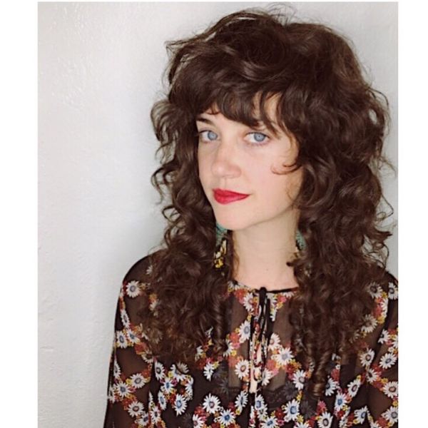 Curly Long Layered Hairstyle with Chunky Bangs