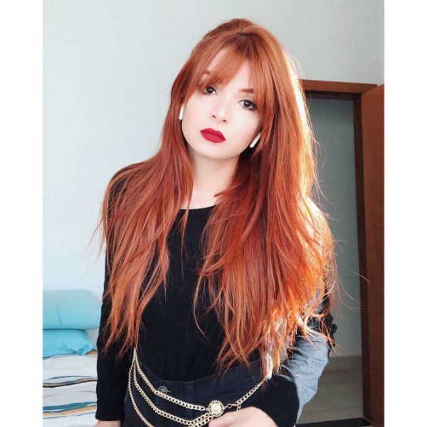 Long V-shaped Layers for Red Hair with Straight Bangs