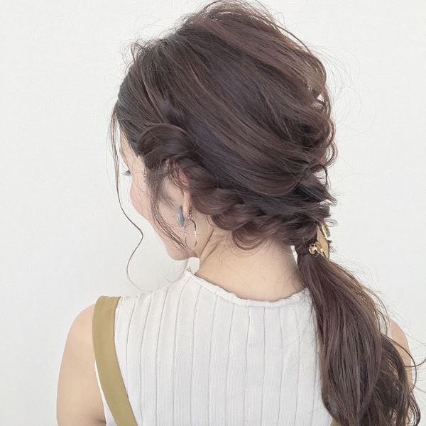 Messy Braided and Twisted Updo with Crown Braids and Ponytail