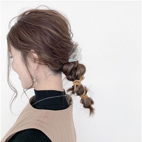 Messy Knotted Low Ponytail with Falling Front Pieces for Long Hair