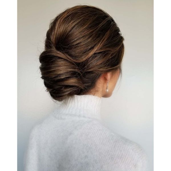 Tucked and Twisted Chignon for Layered Caramel Balayage Hair