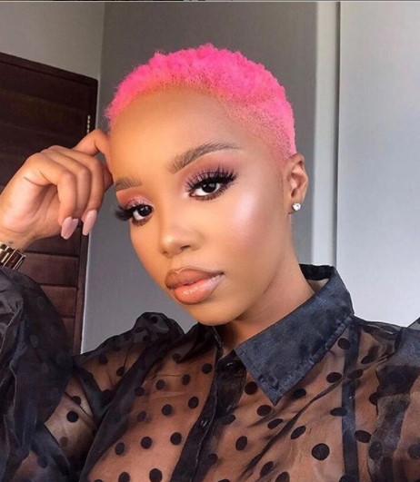 a woman with Neon Pink Blurry Fade Hairstyle For Black Women
