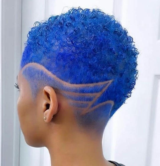 a woman with Royal Blue shaved hairstyles for black women with Side Razor Design