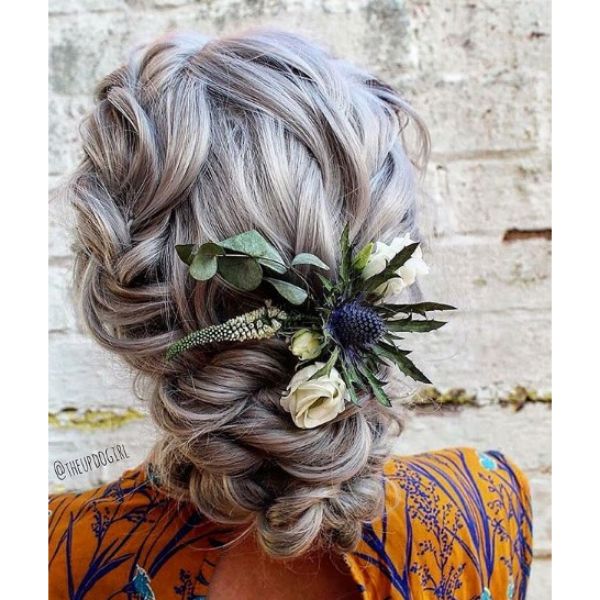 Ashy Twisted Bun Hairstyle with Flower Arrangement