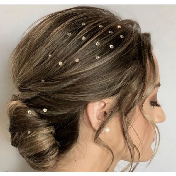Low Bun with Airy Texture Styled with Swarovski crystals