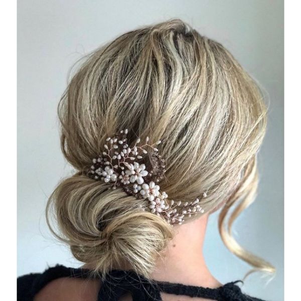  Low Bun with Falling Strands Hairstyle