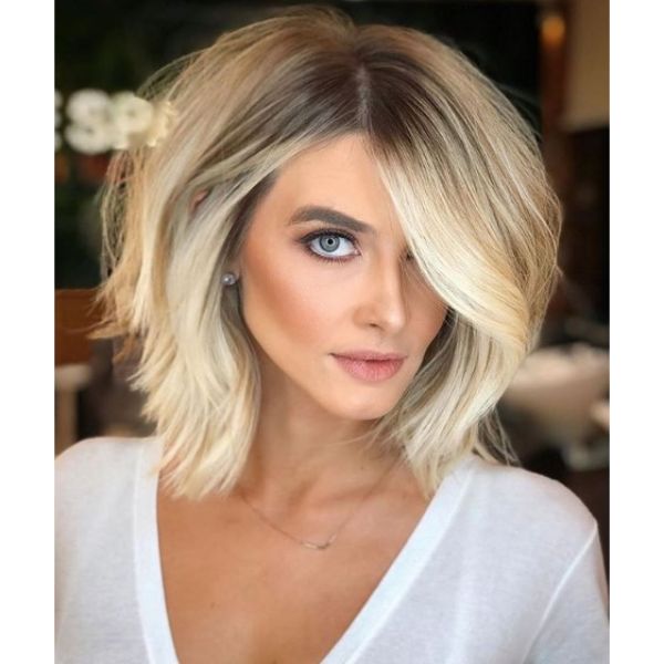  Mid Length Voluminous Hairstyle with Wavy Strands