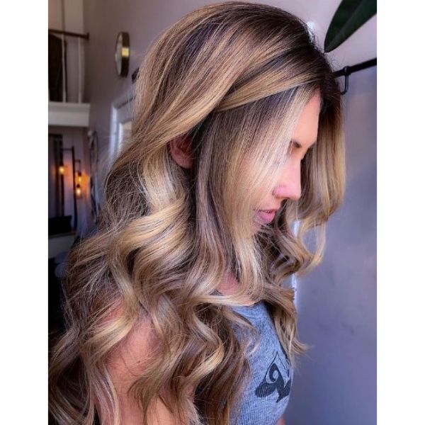 Bright Blonde Balayage Hairstyle With Flowy Curls