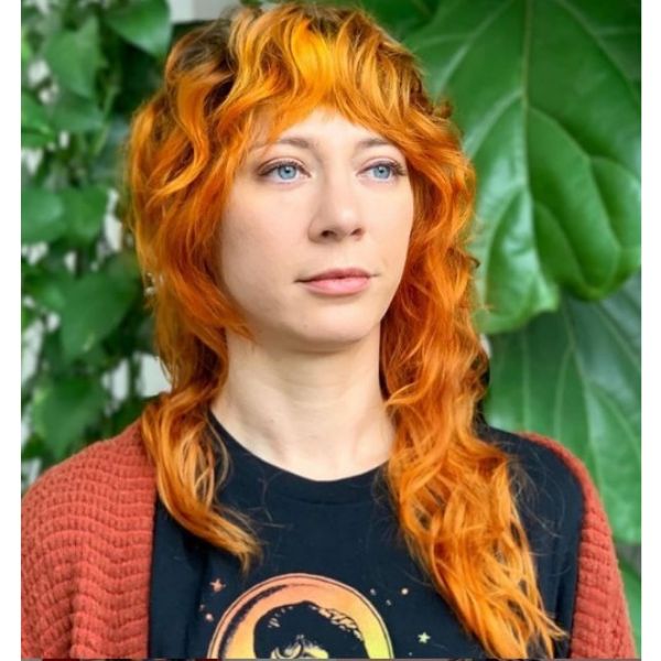 Bright Orange Colored Shag Haircut For Wavy Hair