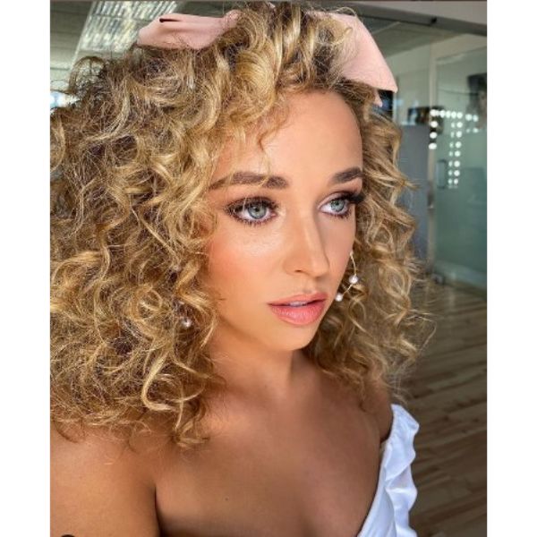  Curly Hairstyle For Blonde Hair With Pink Ribbon