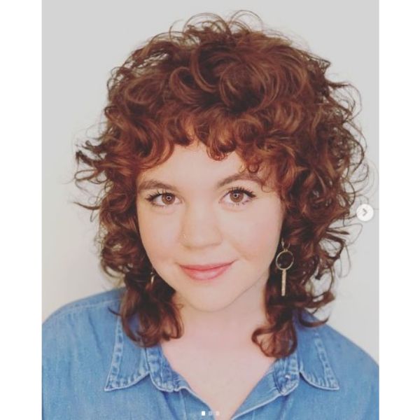 Curly Shag For Short Red Hair With Face Framing Bangs