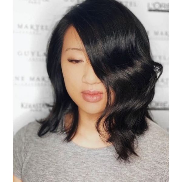 Dark Colored Curly Bob With Side Part Haircut For Oval Face And Thin Hair