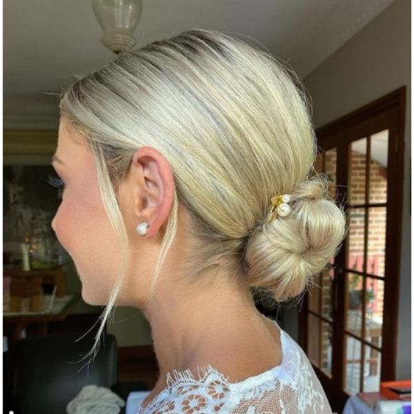 Elegant Low Chignon With Face Framing Pieces Hairstyle