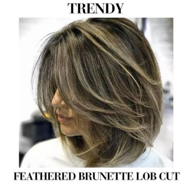 Feathered Brunette Lob Haircut With Thin Blonde Highlights