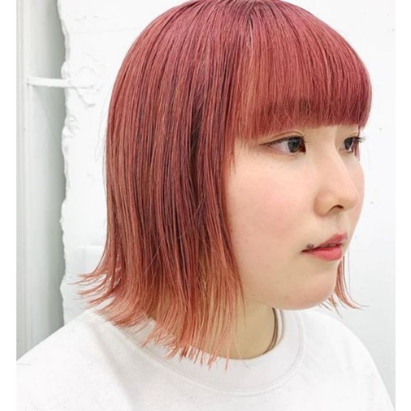 Red Colored Bob With Straight Bangs Hairstyle