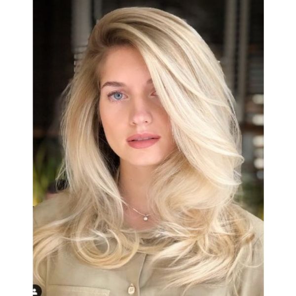 Romantic Waves Hairstyle With Deep Part
