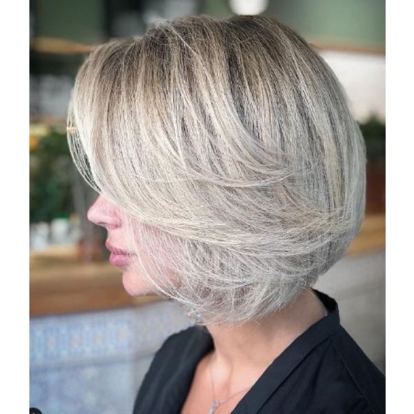  Short Bob With Subtle Feathered Layers For Silver Blonde Hair