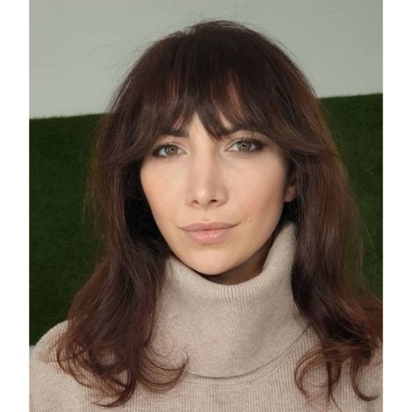 Soft Shag Haircut For Oval Face With Thick Bangs