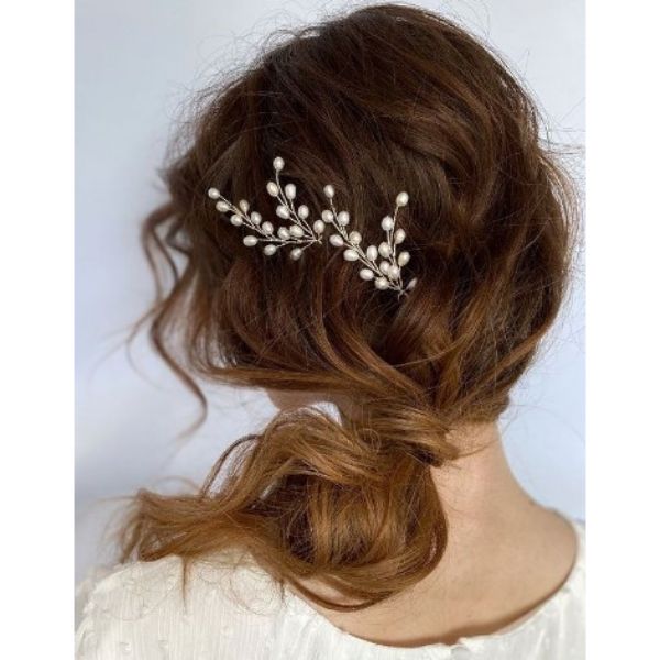  Soft Updo With Low Ponytail And Flower Pin
