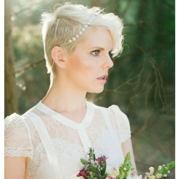 a woman with Ice Blonde Pixie With Pearls wedding hairstyles for short hair