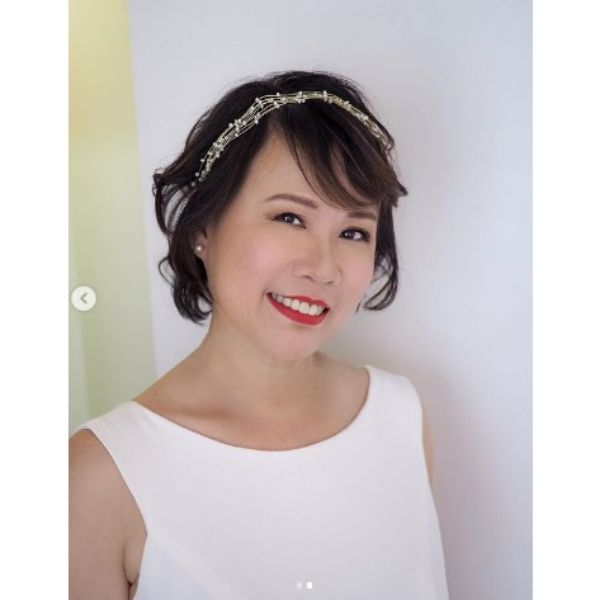an asian woman with Messy Pixie With Thin Headband wearing white sleeveless