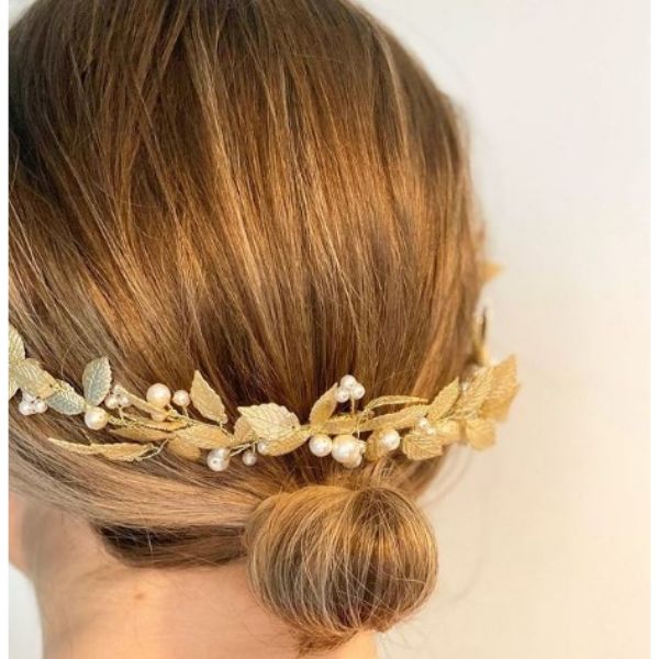 a woman with Mini Bun With Golden Leaf Half Halo And Pearls