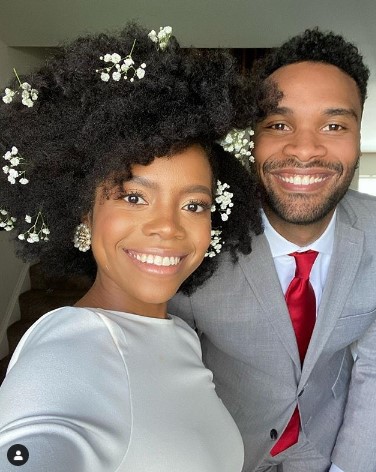 a woman with Short Afro with her partner