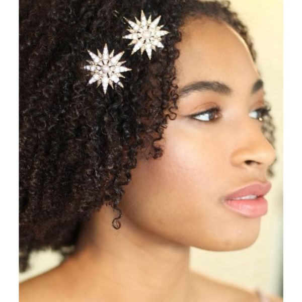 a woman with Short Afro With Daisy Hairpins