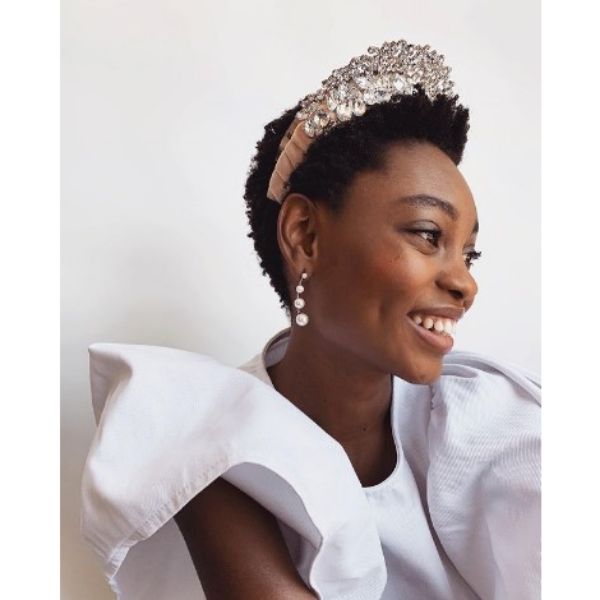 a woman with Short Dark Twa With Massive Studded Jewel Crown