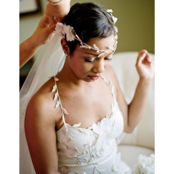 a woman with Short Natural Pixie With Floral Headpiece