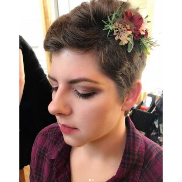 a woman with Short Pixie With Flower Accessory wearing e red checkered