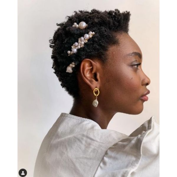 a woman with Simple Short Kinky Curly Haircut With Pearl Hair Sliders