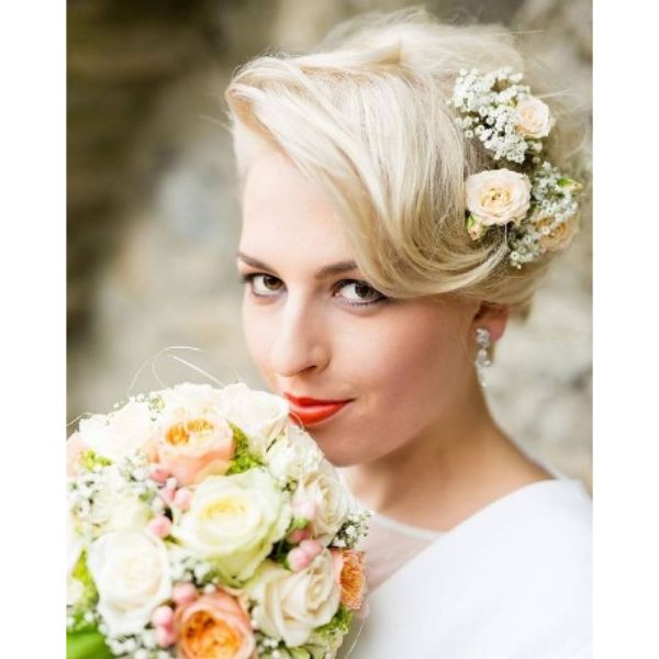 a woman with Soft Blonde Pixie wedding hairstyles for short hair With Side Flower Band