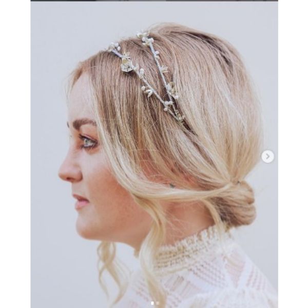 a woman in Subtle Twisted Updo With Flower Headband