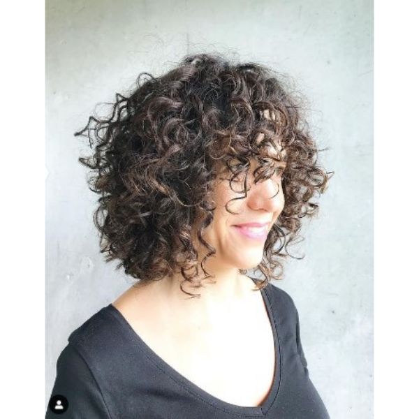 Medium Curly Bob Hairstyle With Curly Bangs For Older Women
