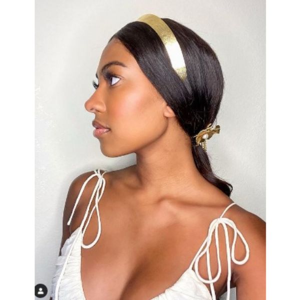 Sleek Low Ponytail With Golden Headband - ponytail hairstyles for black women