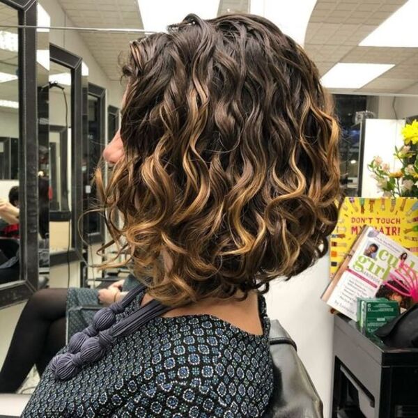 Short Curly Bob Hairstyle - A woman inside the salon