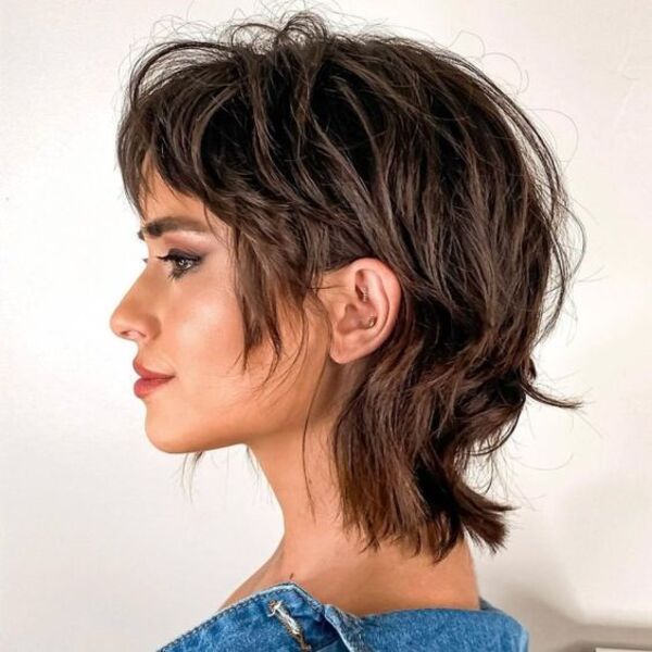 Center-Parted Shag for Short Layered Hair - A woman in her denim top