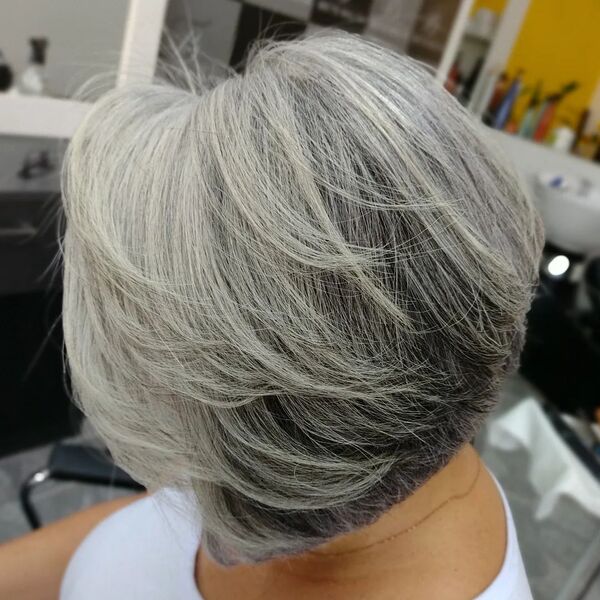 Classy Short Shaggy Pixie Hairstyle - a woman in a salon and is wearing a white shirt