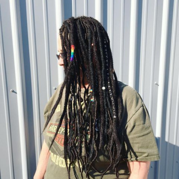 Rasta Dreads with Accessories - A woman wearing an army green shirt