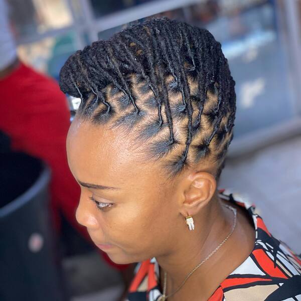 Retwist and Style Up Dreadlocks - A woman with earrings and necklace Dreadlock Hairstyles