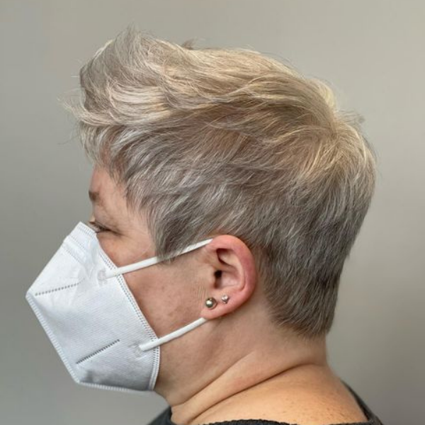 Salt and Pepper Textured Pixie Hair - A woman wearing white mask