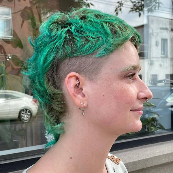 Pixie Curls With Green Tone - a woman in a side view