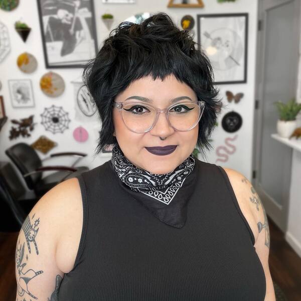 Pixie Cut cith Choppy Bangs - a woman wearing an eyeglasses