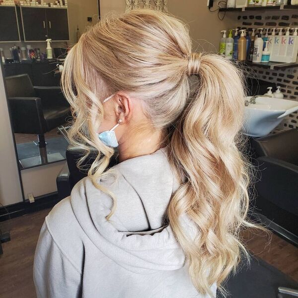 Prom Hair Ponytail Updo - A woman inside a salon