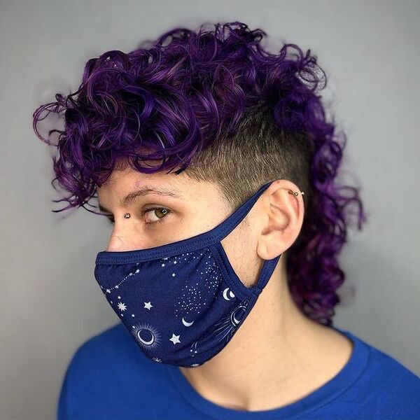 Purple Curly Mullet Hairstyles - a woman wearing a blue face mask